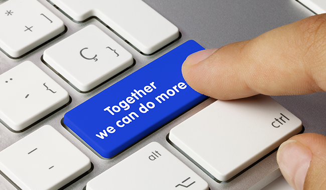 Together we can do more spelled out in white lettering on a blue key surrounded by white keys. Finger touching the key.